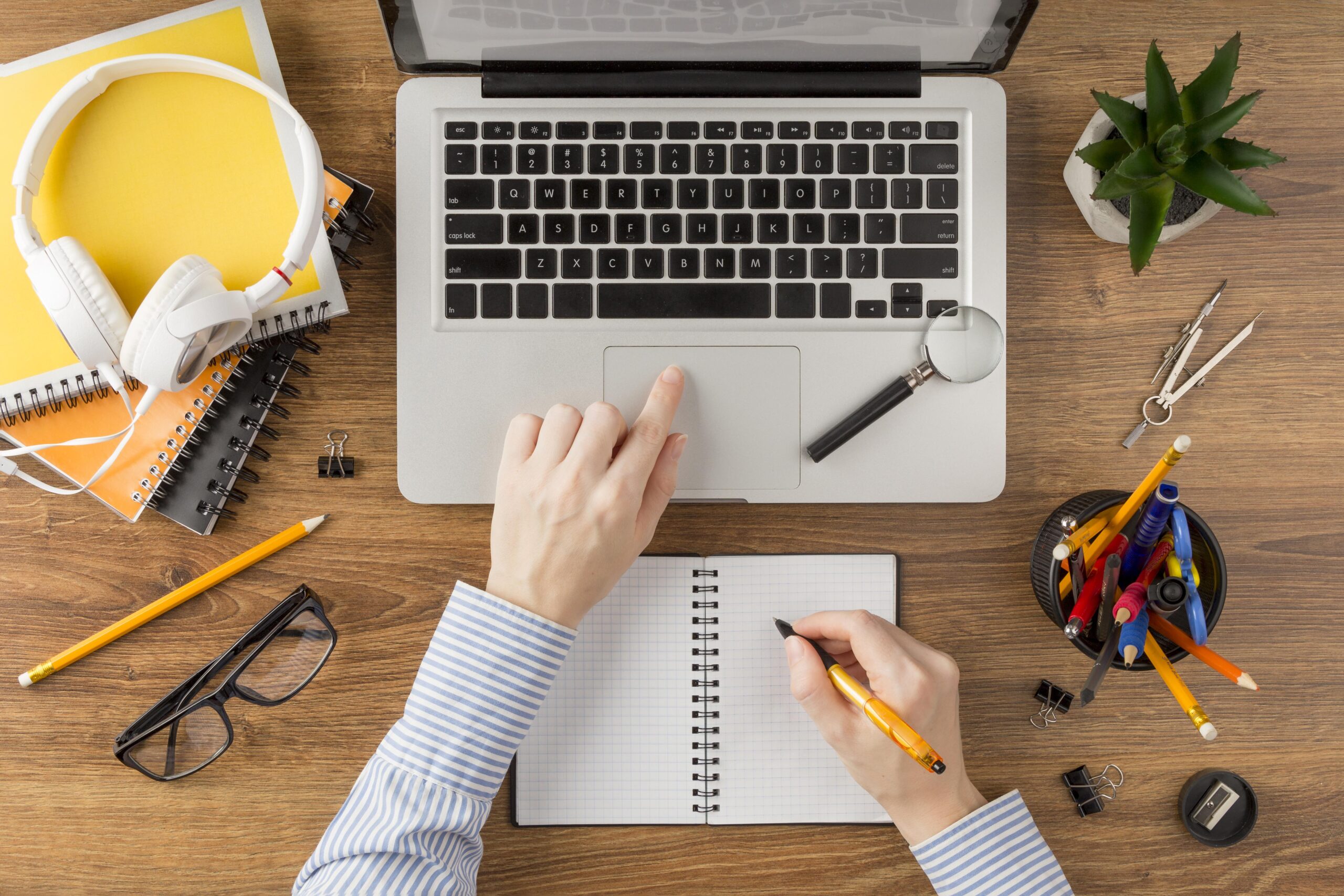 student-writing-notebook-desk